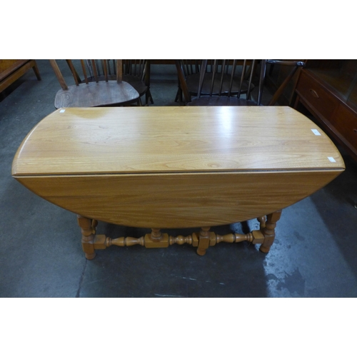 49 - An Ercol Blonde ash drop leaf coffee table