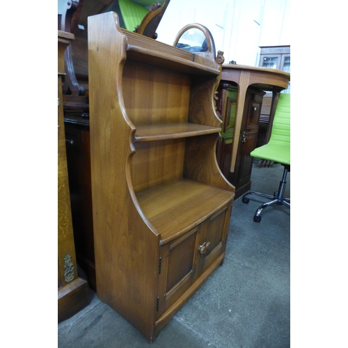 50 - An Ercol Golden Dawn ash open bookcase