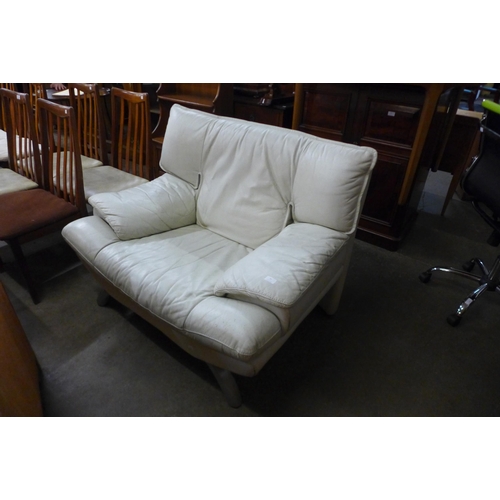 51 - A white leather and chrome armchair