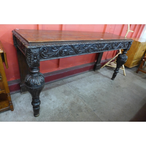 84 - A Victorian Elizabethan Revival carved oak serving table