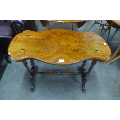 90 - A Victorian inlaid walnut stretcher table