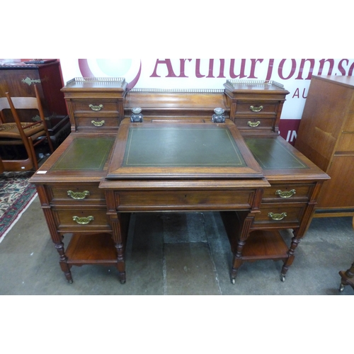 94 - A Victorian walnut and green leather topped Dickens desk, made by Charles Gregory & Co., Regent Stre... 