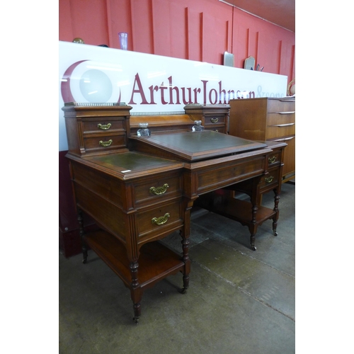 94 - A Victorian walnut and green leather topped Dickens desk, made by Charles Gregory & Co., Regent Stre... 