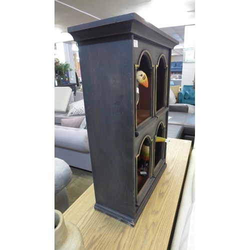 1315 - A black and gold wall shelving unit