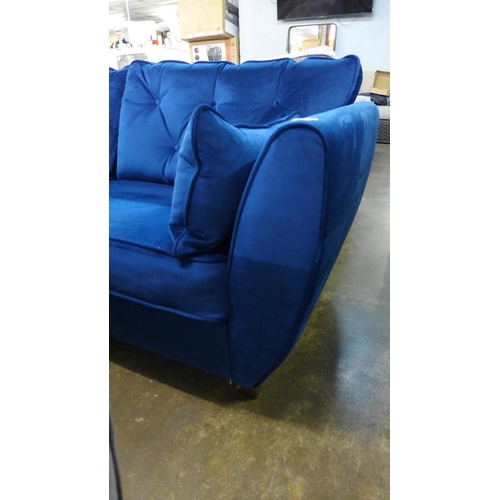 1423 - A Hoxton blue velvet three seater sofa