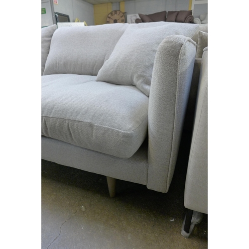 1450 - A dove grey upholstered four seater sofa