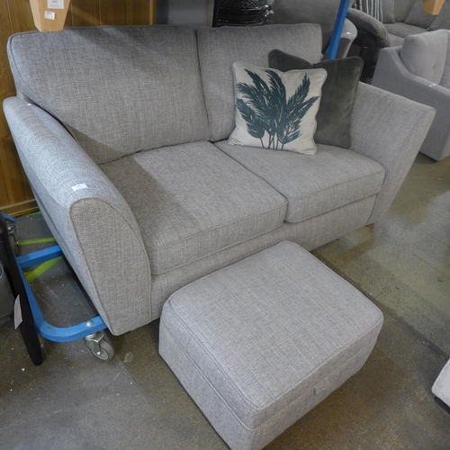 1483 - A grey textured weave two seater sofa and footstool