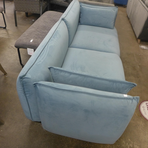 1426 - A sky blue velvet four seater sofa with chrome feet