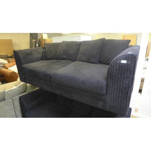 1486 - A black jumbo cord three seater sofa