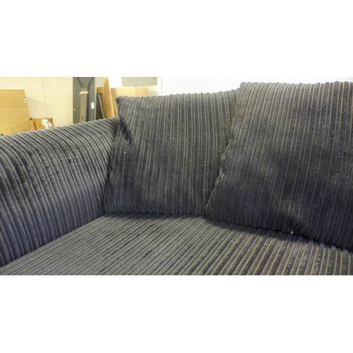 1486 - A black jumbo cord three seater sofa