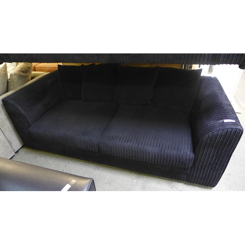 1487 - A black jumbo cord three seater sofa