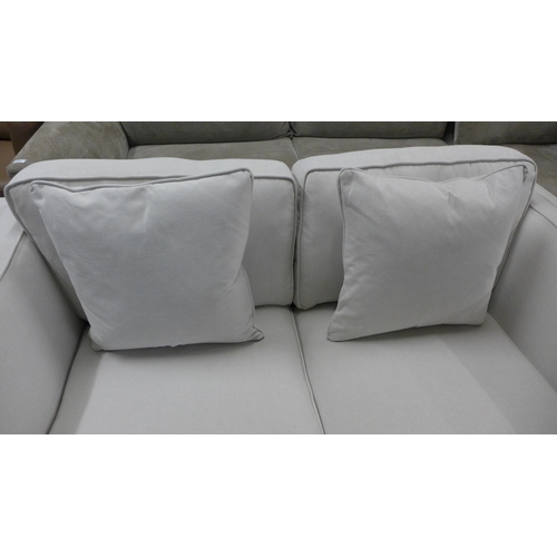 1354 - A light grey fabric upholstered two seater sofa