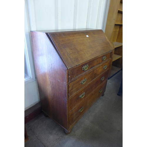 166 - A George III oak bureau