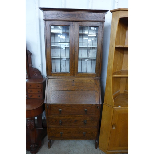 102 - An early 20th Century oak bureau bookcase