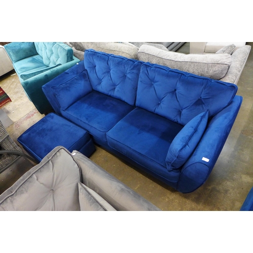 1323 - A Hoxton blue velvet three seater sofa