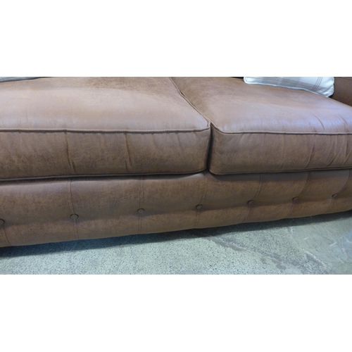 1476 - A faux leather upholstered county style three seater sofa with patterned scatter cushions