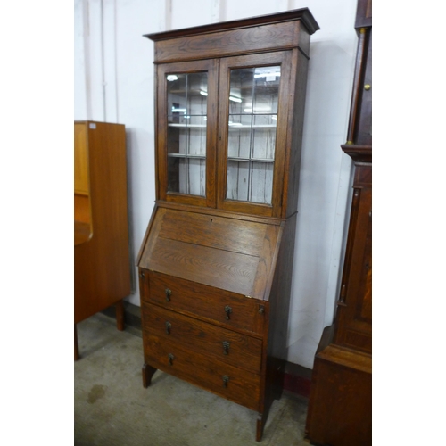 102 - An early 20th Century oak bureau bookcase