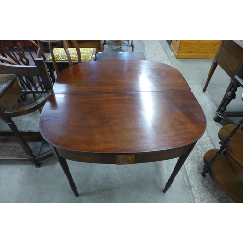 141 - A George IV mahogany demi-lune fold over tea table