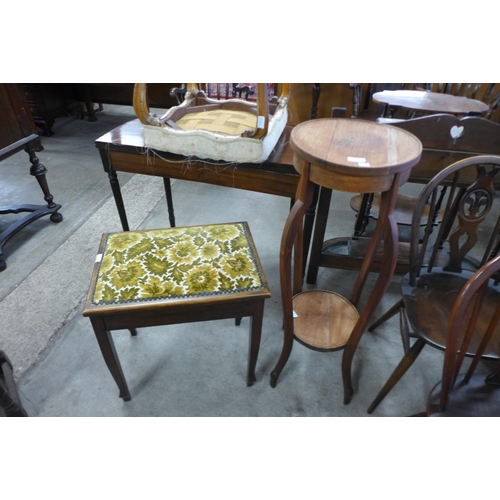 152 - A mahogany jardiniere stand and a piano stool