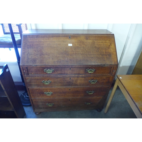 166 - A George III oak bureau