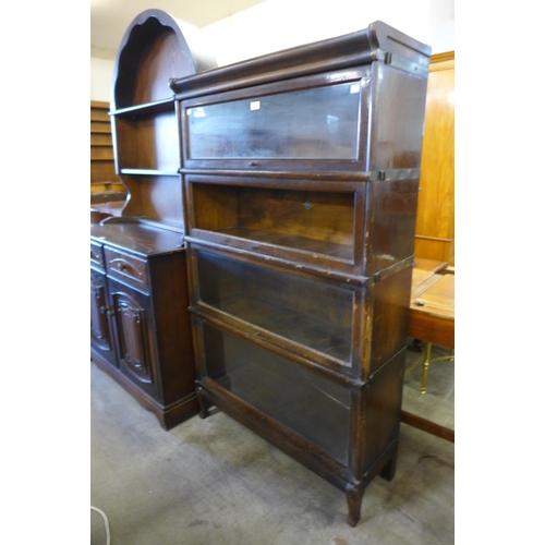 171 - An early 20th Century Globe Wernicke oak four tier sectional stacking bookcase