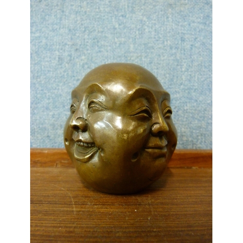 306 - A small bronze four faced Buddha