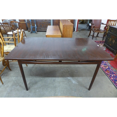 33 - A G-Plan Danish Design teak extending dining table, designed by Ib Kofod Larson