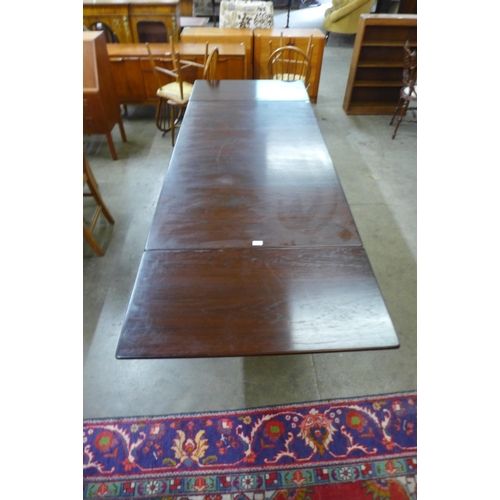 33 - A G-Plan Danish Design teak extending dining table, designed by Ib Kofod Larson