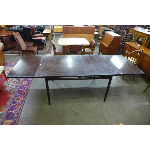 33 - A G-Plan Danish Design teak extending dining table, designed by Ib Kofod Larson