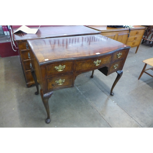 66 - A George III style burr walnut serpentine desk