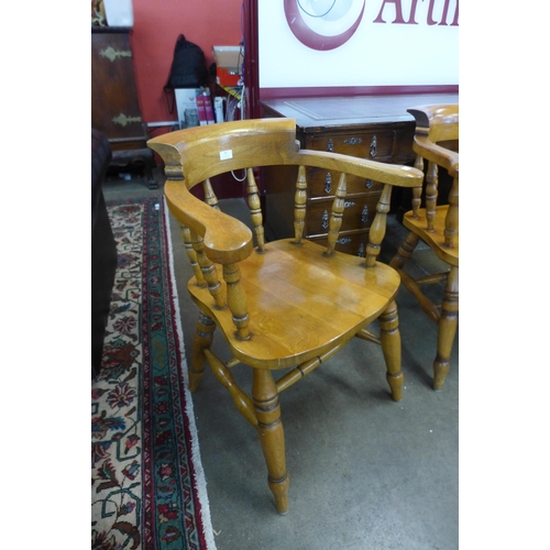 68 - A set of four elm and beech smokers bow chairs