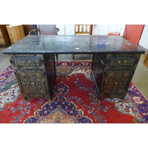 76 - A Chinese black chinoiserie lacquered desk