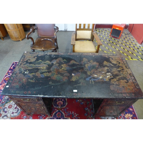 76 - A Chinese black chinoiserie lacquered desk