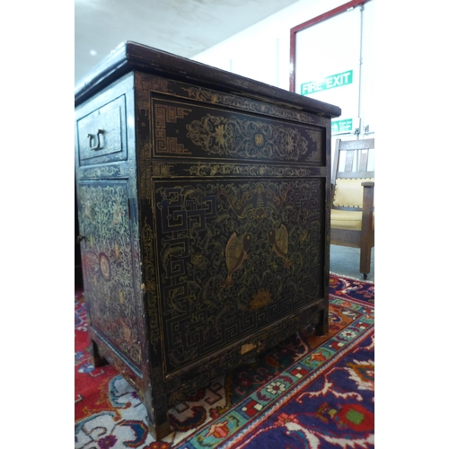 76 - A Chinese black chinoiserie lacquered desk