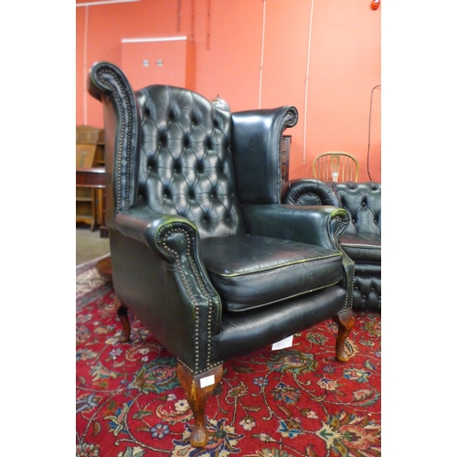 83 - A green leather Chesterfield three piece suite, comprising wingback armchair, club chair and a three... 