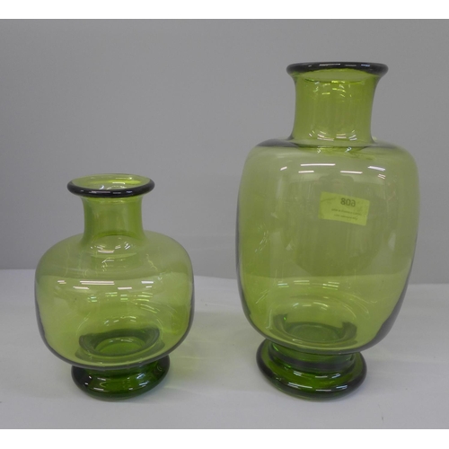 608 - A set of two 1950's green signed Holmegaard art glass vases designed by Per Lutken, 21cm and 14cm