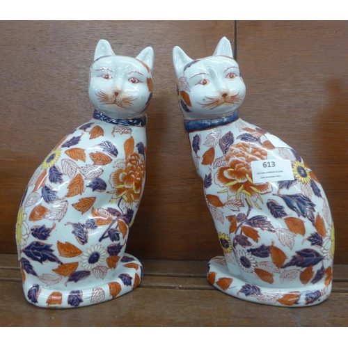 613 - A pair of oriental Imari cat figures. 26cm, each with six character mark to the base