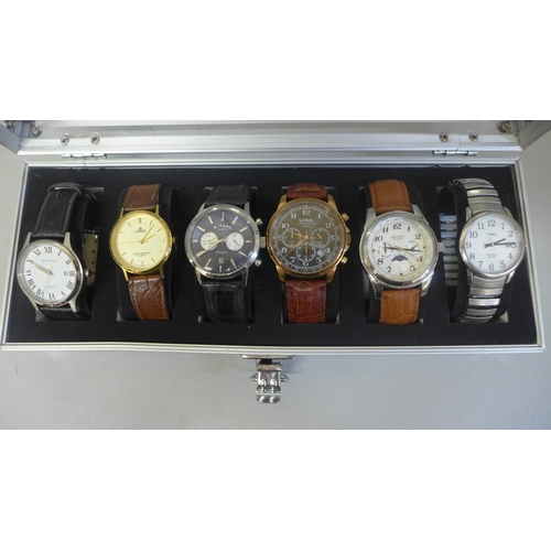 628 - An aluminium watch storage box with six wristwatches including Rotary Avenger chronograph