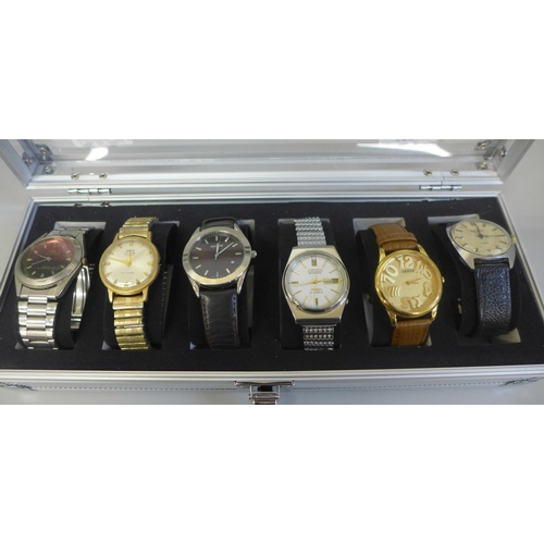 629 - An aluminium watch storage box with six wristwatches including Citizen automatic and Oris Super