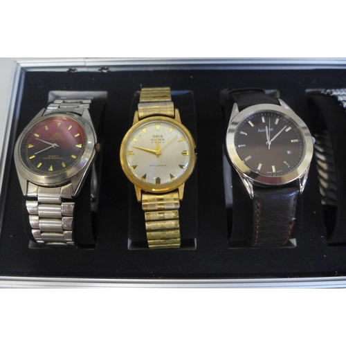 629 - An aluminium watch storage box with six wristwatches including Citizen automatic and Oris Super