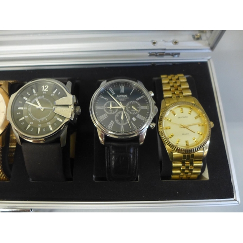 630 - An aluminium watch storage box with six wristwatches including Guess, Storm and Diesel