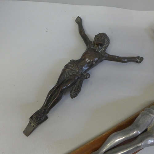 636 - A 19th Century bronze crucifix and an alloy crucifix