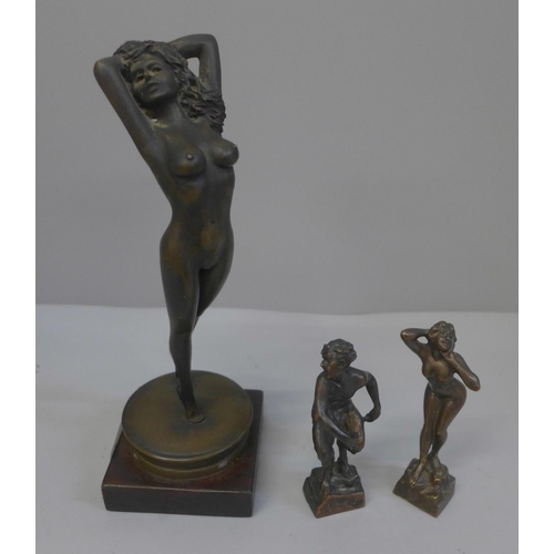 650 - Two small bronze figures; a Satyr and a nude and a larger figure of a nude