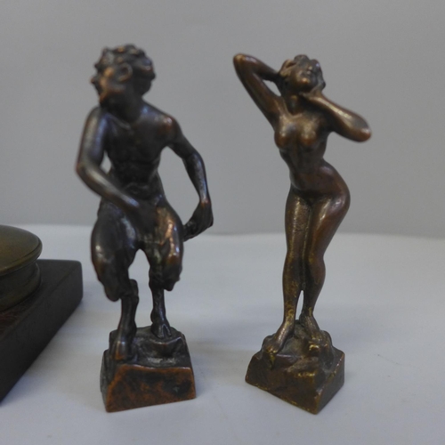 650 - Two small bronze figures; a Satyr and a nude and a larger figure of a nude