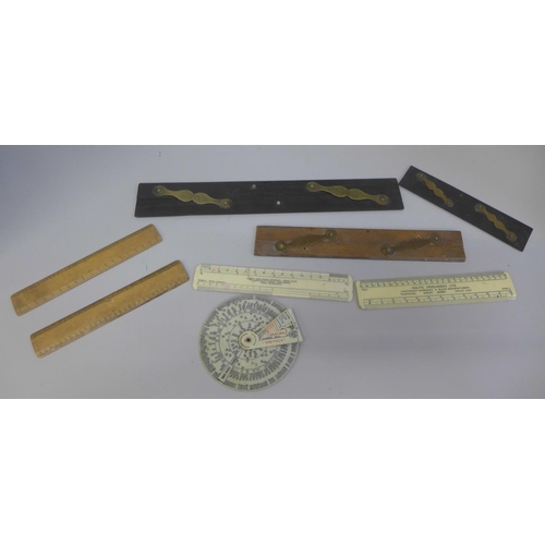 653 - A collection of early 20th Century rulers and parallel rulers