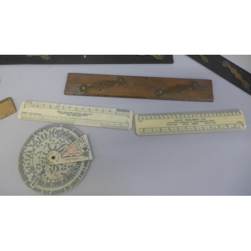 653 - A collection of early 20th Century rulers and parallel rulers