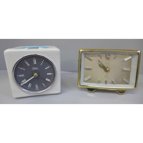 659 - A 1970s West German pottery ceramic clock and a retro Chinese alarm clock