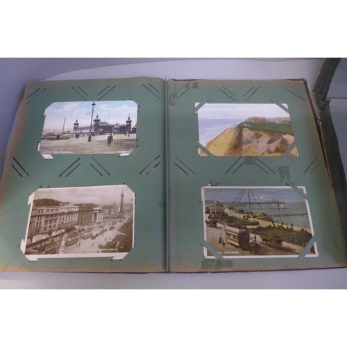 679 - Two albums of Edwardian and later postcards