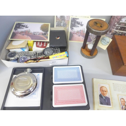 683 - A collection of assorted items including wristwatches, a Dalvey travel clock, playing cards, dominoe... 