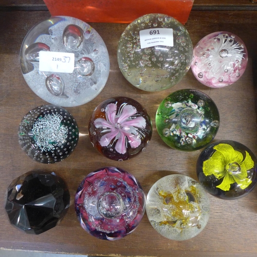 691 - A collection of ten glass paperweights